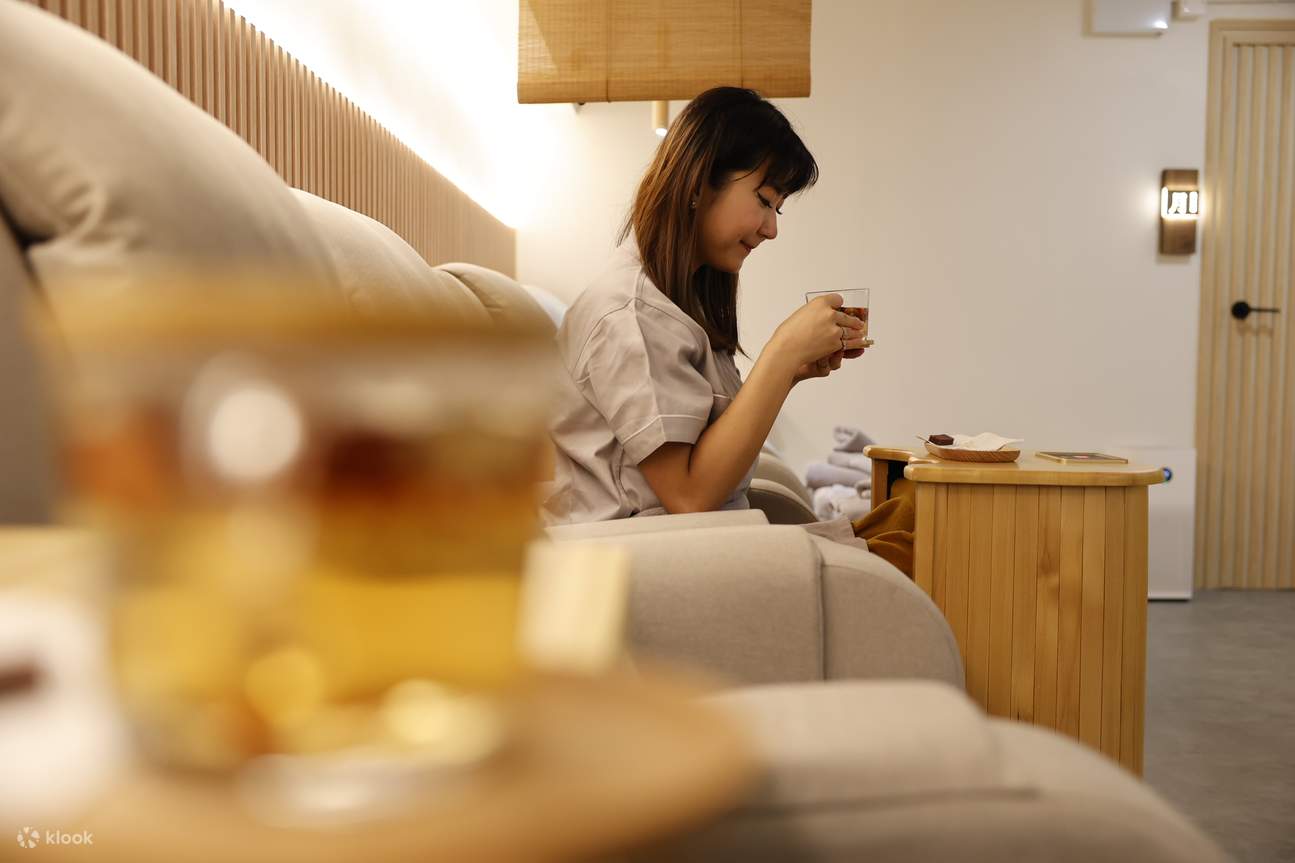 Foot bath with a cup of herbal tea